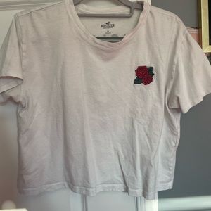 white hollister tee with flower; size medium; in outstanding condition